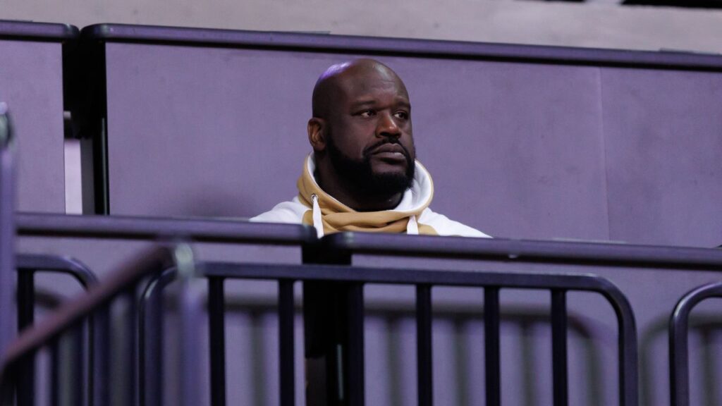 Former NBA player Shaquille O'Neal sits courtside during the first half between the Florida Gators and the LSU Tigers at Exactech Arena at the Stephen C. O'Connell Center.