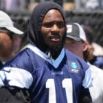 Jul 27, 2025; Oxnard, CA, USA; Dallas Cowboys safety Donovan Wilson (6), defensive end Micah Parsons (11) and safety Malik Hooker (28) watch from the sidelines at training camp at the River Ridge Fields.