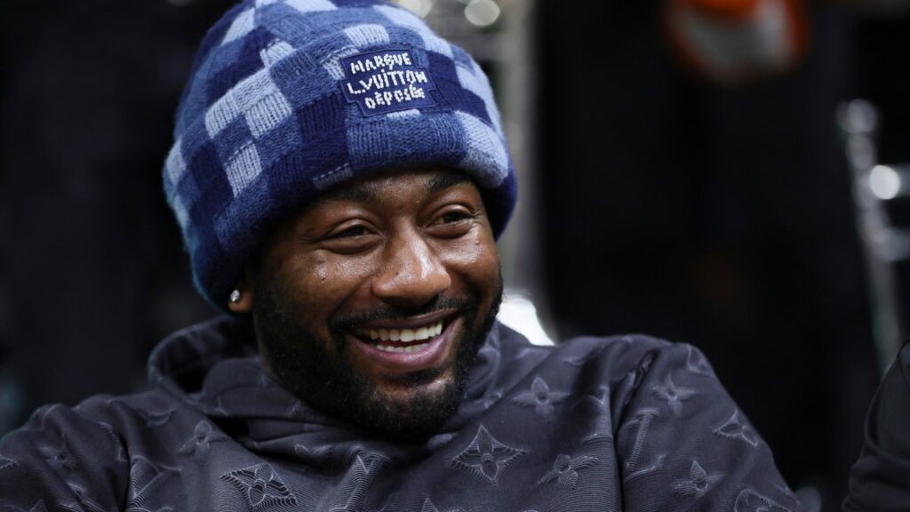 American professional basketball player John Wall attends the game between the Pittsburgh Panthers and the Miami Hurricanes at Watsco Center.