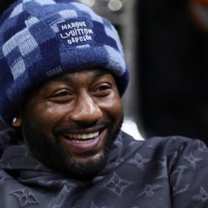 American professional basketball player John Wall attends the game between the Pittsburgh Panthers and the Miami Hurricanes at Watsco Center.