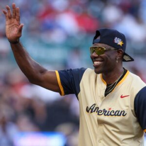 NFL Hall of Fame wide receiver Terrell Owens of the American League shows emotion during the 2025 All Star Celebrity Softball Game at Truist Park.