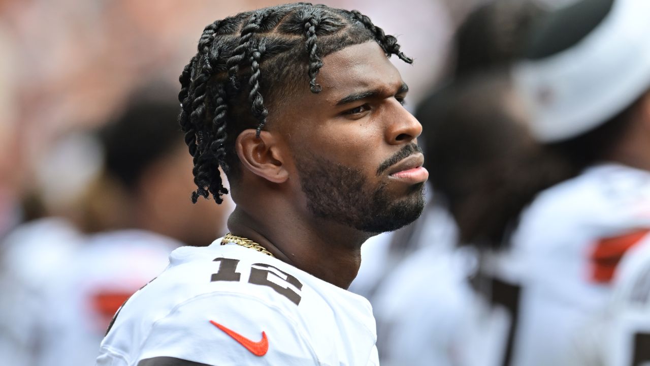 Cleveland Browns quarterback Shedeur Sanders (12) listens to the national anthem before the game between the Browns and the Los Angeles Rams at Huntington Bank Field.