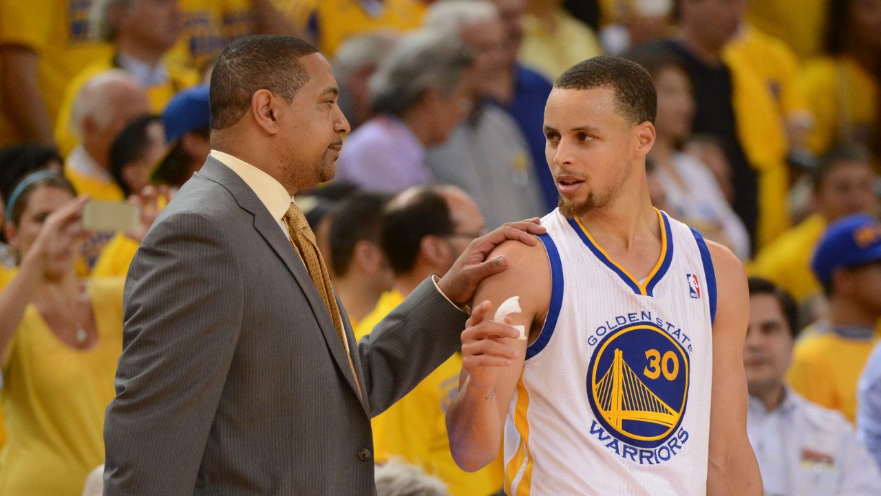 Golden State Warriors head coach Mark Jackson (left) talks to guard Stephen Curry (30) against the Los Angeles Clippers during the fourth quarter in game six of the first round of the 2014 NBA Playoffs at Oracle Arena. The Warriors defeated the Clippers 100-99.