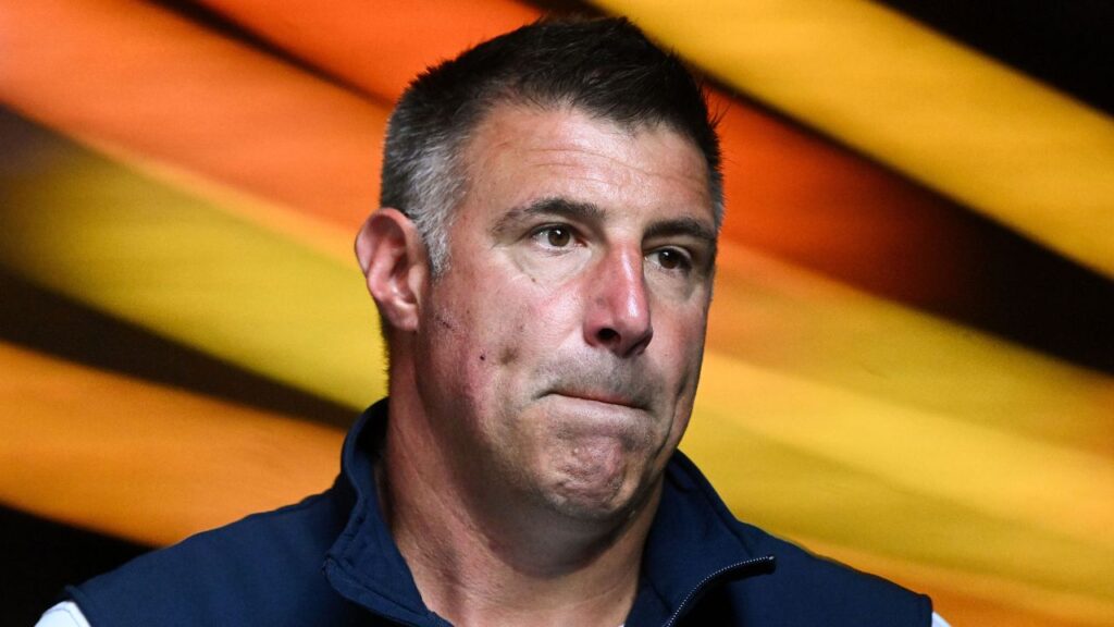 New England Patriots head coach Mike Vrabel walks onto the field before a game against the Washington Commanders at Gillette Stadium.