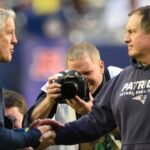 Seattle Seahawks head coach Pete Carroll on the left talks with New England Patriots head coach Bill Belichick before Super Bowl XLIX at University of Phoenix Stadium.