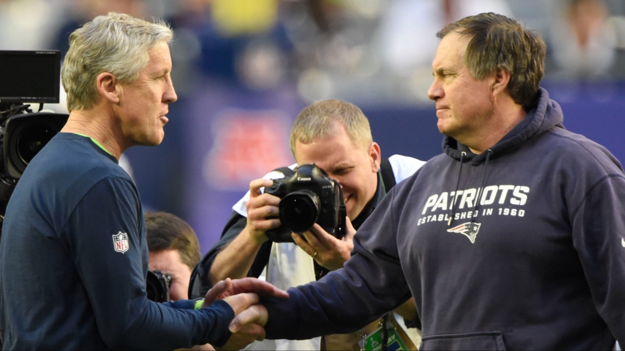 Seattle Seahawks head coach Pete Carroll on the left talks with New England Patriots head coach Bill Belichick before Super Bowl XLIX at University of Phoenix Stadium.