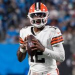 Cleveland Browns quarterback Shedeur Sanders (12) looks downfield for a receiver during the second half against the Carolina Panthers at Bank of America Stadium.