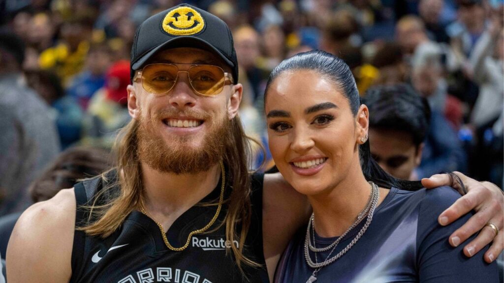 San Francisco 49ers tight end George Kittle and wife Claire Kittle at a game between Golden State Warriors and Philadelphia 76ers during the second quarter at Chase Center.