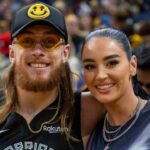 San Francisco 49ers tight end George Kittle and wife Claire Kittle at a game between Golden State Warriors and Philadelphia 76ers during the second quarter at Chase Center.