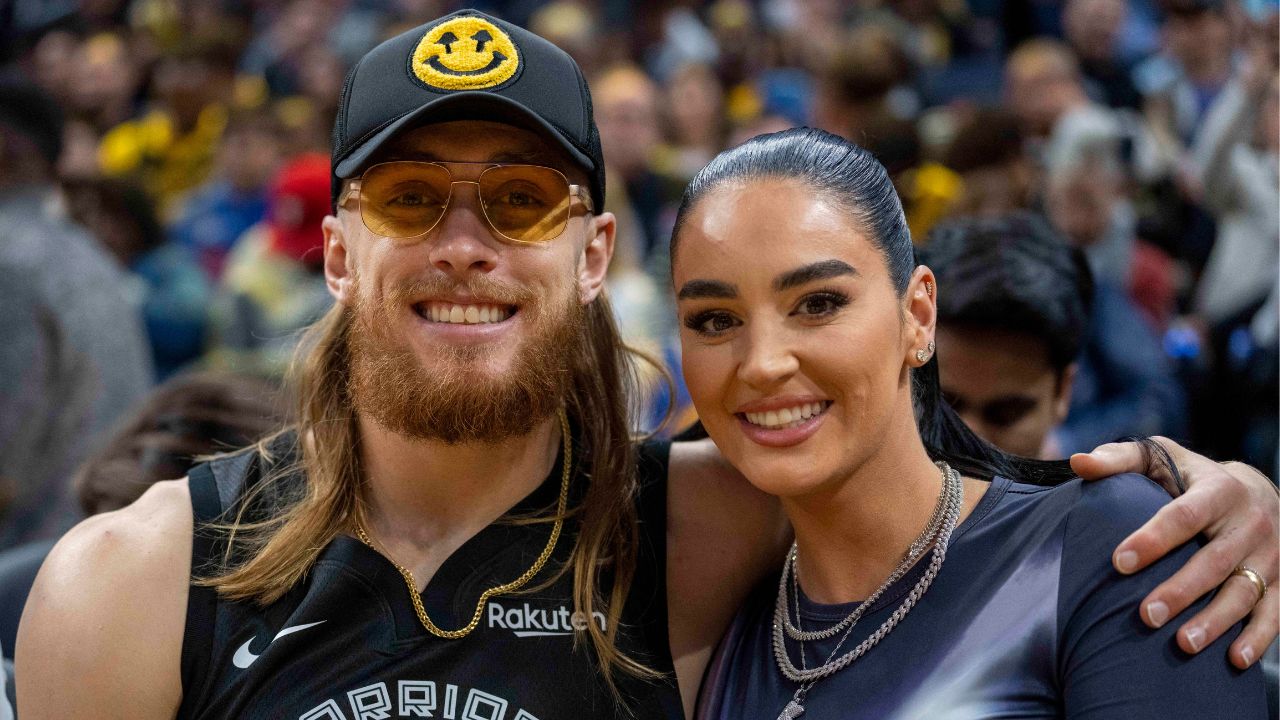 San Francisco 49ers tight end George Kittle and wife Claire Kittle at a game between Golden State Warriors and Philadelphia 76ers during the second quarter at Chase Center.