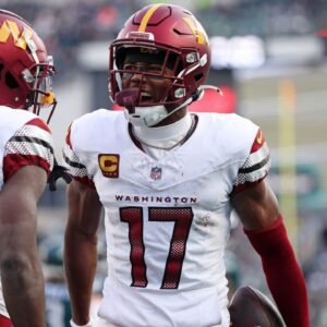 Washington Commanders wide receiver Terry McLaurin (17) reacts after a play with wide receiver Olamide Zaccheaus (14) against the Philadelphia Eagles during the first half in the NFC Championship game at Lincoln Financial Field.