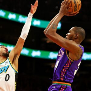 Dec 19, 2024; Phoenix, Arizona, USA; Phoenix Suns forward Kevin Durant (35) shoots the ball against Indiana Pacers guard Tyrese Haliburton (0) during the third quarter at Footprint Center.