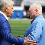 Los Angeles Rams owner Stan Kroenke (left) talks with Dallas Cowboys owner Jerry Jones during the game at SoFi Stadium.