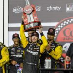 Ryan Blaney (22) and team celebrate the win during the Coke Zero Sugar 400 at Daytona International Speedway.