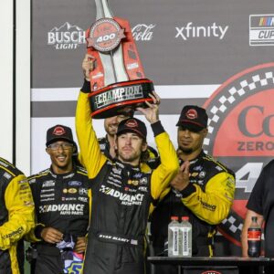 Ryan Blaney (22) and team celebrate the win during the Coke Zero Sugar 400 at Daytona International Speedway.