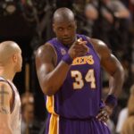 Shaquille O Neal points to the other end of the court, where fouls were not called, when Mike Bibby complains that a foul wasn t called on Bibby s drive to the basket.in game one of the NBA Basketball Herren USA Western Conference Finals between the Sacramento Kings and the Los Angeles Lakers