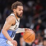 Atlanta Hawks guard Trae Young (11) drives to the basket against the Philadelphia 76ers in the third quarter at State Farm Arena.