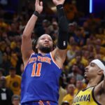 New York Knicks guard Jalen Brunson (11) shoots the ball against Indiana Pacers guard Andrew Nembhard (2) in the third quarter during game six of the eastern conference finals for the 2025 NBA Playoffs at Gainbridge Fieldhouse.