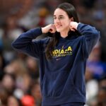 Indiana Fever guard Caitlin Clark (22) walks on to the court during the second half against the Dallas Wings at the American Airlines Center.