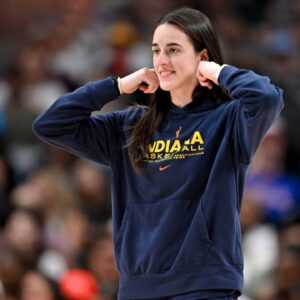Indiana Fever guard Caitlin Clark (22) walks on to the court during the second half against the Dallas Wings at the American Airlines Center.