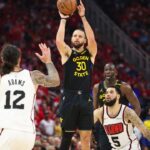 Golden State Warriors guard Stephen Curry (30) shoots the ball during the second quarter of game seven of the first round for the 2025 NBA Playoffs against the Houston Rockets at Toyota Center.