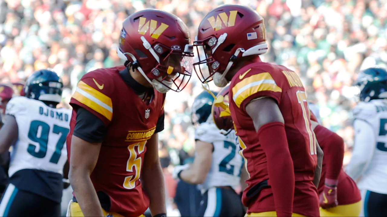 Washington Commanders quarterback Jayden Daniels (5) celebrates with Commanders wide receiver Terry McLaurin (17) after connecting on a touchdown pass against the Philadelphia Eagles during the second quarter at Northwest Stadium.