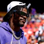 Baltimore Ravens quarterback Lamar Jackson (8) walks on the field before the game against the Washington Commanders at Northwest Stadium.