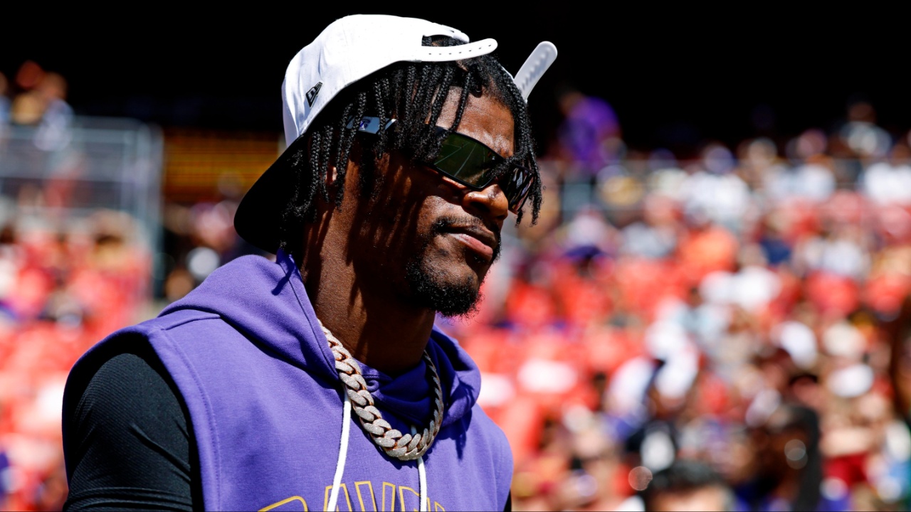 Baltimore Ravens quarterback Lamar Jackson (8) walks on the field before the game against the Washington Commanders at Northwest Stadium.