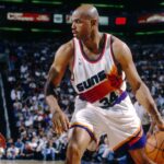 Phoenix Suns forward Charles Barkley (34) is defended by Seattle Supersonics forward Detlef Schrempf (11) at America West Arena.