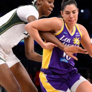 Los Angeles Sparks guard Kelsey Plum (10) drives to the basket defended by Seattle Storm forward Ezi Magbegor (13) during the second quarter at Crypto.com Arena.