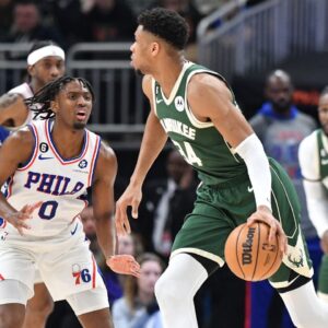 Milwaukee Bucks forward Giannis Antetokounmpo (34) dribbles the ball against Philadelphia 76ers guard Tyrese Maxey (0) in the second half at Fiserv Forum.