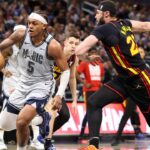 Orlando Magic forward Paolo Banchero (5) drives to the basket past Atlanta Hawks forward Larry Nance Jr. (22) in the third quarter at Kia Center.