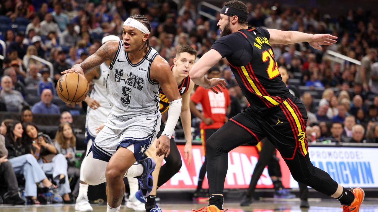 Orlando Magic forward Paolo Banchero (5) drives to the basket past Atlanta Hawks forward Larry Nance Jr. (22) in the third quarter at Kia Center.