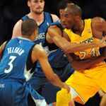 Los Angeles Lakers shooting guard Kobe Bryant (24) is defended by Minnesota Timberwolves point guard Sebastian Telfair (3), small forward Wesley Johnson (4) and power forward Kevin Love (42) during the first half at the Staples Center