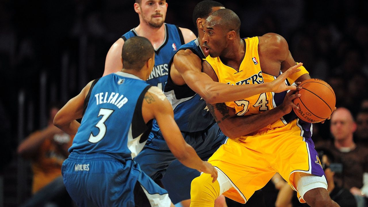 Los Angeles Lakers shooting guard Kobe Bryant (24) is defended by Minnesota Timberwolves point guard Sebastian Telfair (3), small forward Wesley Johnson (4) and power forward Kevin Love (42) during the first half at the Staples Center