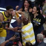 Indiana Pacers guard Tyrese Haliburton (0) reacts with his girlfriend Jade Jones and father John Haliburton following the second quarter against the Oklahoma City Thunder in game four of the 2025 NBA Finals at Gainbridge Fieldhouse.