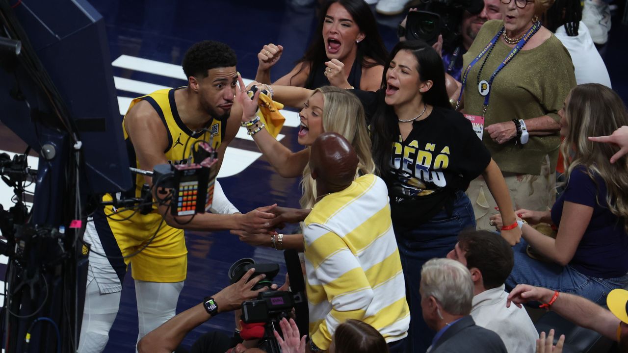 Indiana Pacers guard Tyrese Haliburton (0) reacts with his girlfriend Jade Jones and father John Haliburton following the second quarter against the Oklahoma City Thunder in game four of the 2025 NBA Finals at Gainbridge Fieldhouse.