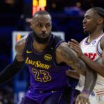 Los Angeles Lakers forward LeBron James (23) controls the ball against Philadelphia 76ers guard Tyrese Maxey (0) during the second quarter at Wells Fargo Center.