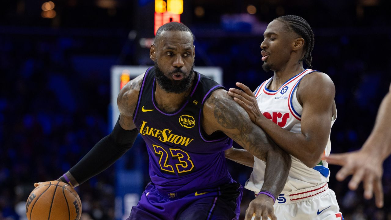 Los Angeles Lakers forward LeBron James (23) controls the ball against Philadelphia 76ers guard Tyrese Maxey (0) during the second quarter at Wells Fargo Center.