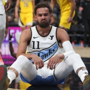 Mar 8, 2025; Atlanta, Georgia, USA; Atlanta Hawks guard Trae Young (11) sits on the court after being fouled by Indiana Pacers forward Pascal Siakam (43) during the first quarter at State Farm Arena