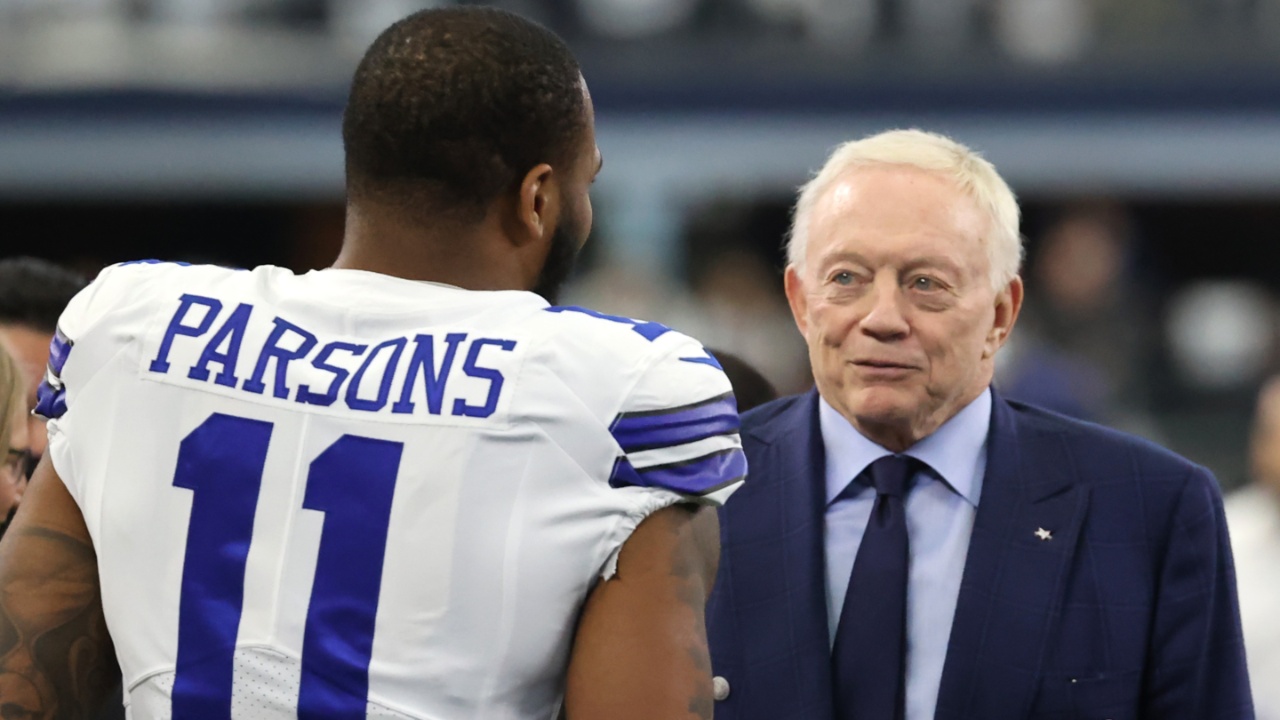 Jan 16, 2022; Arlington, Texas, USA; Dallas Cowboys outside linebacker Micah Parsons (11) meets with owner Jerry Jones (center) and NFL commissioner Roger Goodell (right) prior to the NFC Wild Card playoff football game against the San Francisco 49ers at AT&T Stadium.