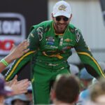 NASCAR Cup Series driver Daniel Suarez (99) shakes hands with fans during driver introductions prior to the NASCAR Cup Series Cook Out 400 at Richmond Raceway.