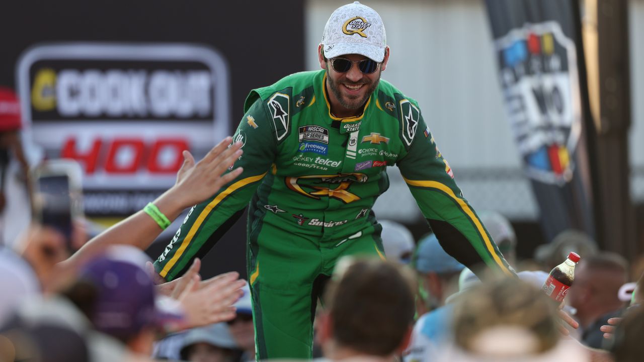 NASCAR Cup Series driver Daniel Suarez (99) shakes hands with fans during driver introductions prior to the NASCAR Cup Series Cook Out 400 at Richmond Raceway.
