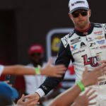 NASCAR Cup Series driver William Byron (24) shakes hands with fans during driver introductions prior to the NASCAR Cup Series Cook Out 400 at Richmond Raceway.