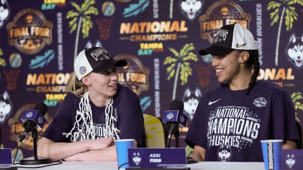 Connecticut Huskies guard Paige Bueckers (5) and guard Azzi Fudd (35) speak to the media after the national championship of the women's 2025 NCAA tournament against the South Carolina Gamecocks at Amalie Arena.