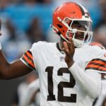 Aug 8, 2025; Charlotte, North Carolina, USA; Cleveland Browns quarterback Shedeur Sanders (12) looks to pass against the Carolina Panthers during the first quarter at Bank of America Stadium.