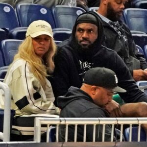 LeBron James and his wife Savannah Brinson watch Bronny James participate in the 2024 NBA Draft Combine at Wintrust Arena