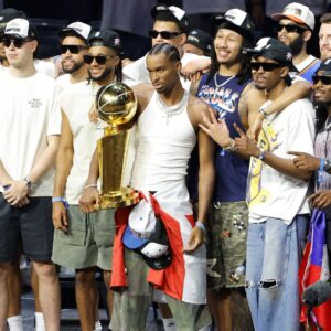 Jun 24, 2025; Oklahoma City, OK, USA; Oklahoma City Thunder guard Shai Gilgeous-Alexander (2) holds the Larry OíBrien Championship Trophy with the team behind him during the Champions Opening Ceremony for the parade inside the Paycom Center.