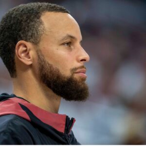 May 8, 2025; Minneapolis, Minnesota, USA; Golden State Warriors guard Stephen Curry (30) looks on from the bench against the Minnesota Timberwolves in the second half during game two of the second round for the 2025 NBA Playoffs at Target Center