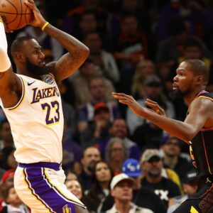 Nov 26, 2024; Phoenix, Arizona, USA; Los Angeles Lakers forward LeBron James (23) against Phoenix Suns forward Kevin Durant (35) during an NBA Cup game at Footprint Center.